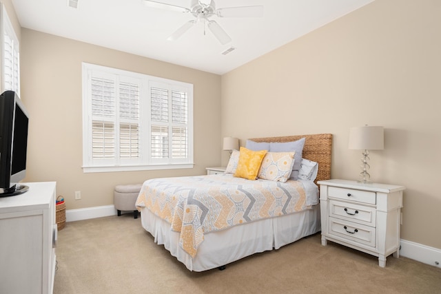 bedroom featuring ceiling fan and light carpet