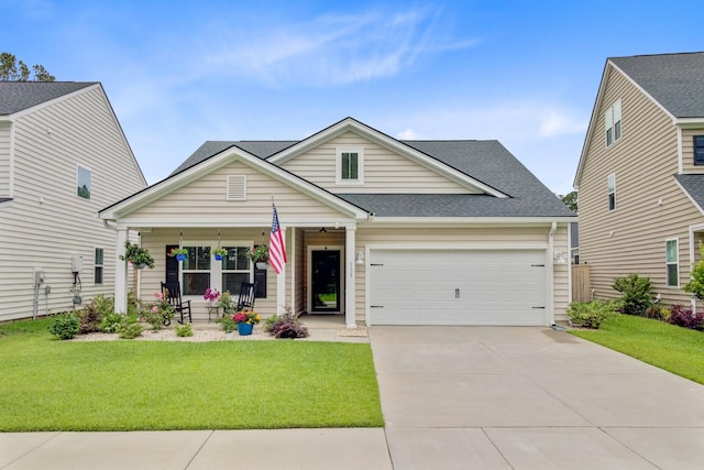 135 Cypress Preserve Blvd, Moncks Corner, SC 29461 - view of front of home with covered porch, a front lawn, an attached garage, driveway, and a shingled roof