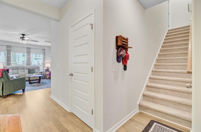 135 Cypress Preserve Blvd, Moncks Corner, SC 29461 - stairs with ceiling fan, baseboards, and wood finished floors