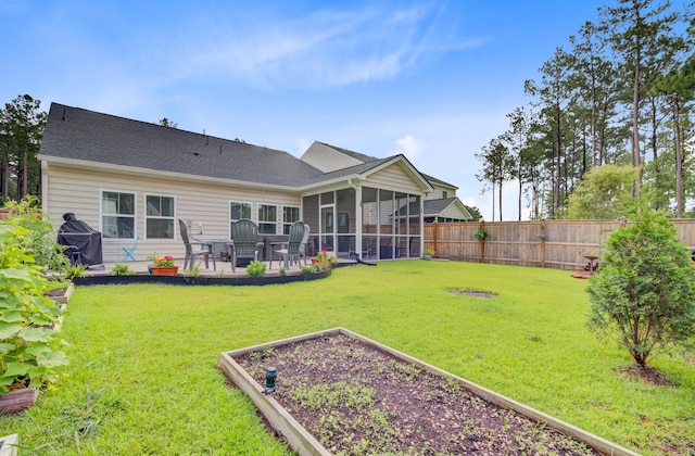 135 Cypress Preserve Blvd, Moncks Corner, SC 29461 - rear view of house featuring a sunroom, a patio area, and a garden