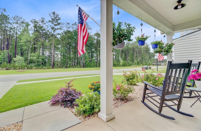135 Cypress Preserve Blvd, Moncks Corner, SC 29461 - covered porch featuring a lawn