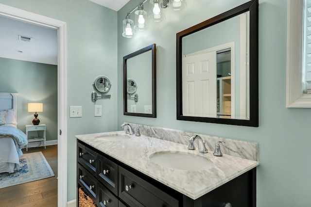 bathroom featuring vanity and wood-type flooring