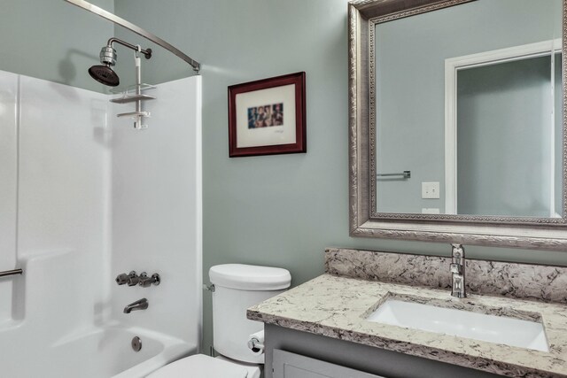 full bathroom with vanity, toilet, and shower / bathtub combination