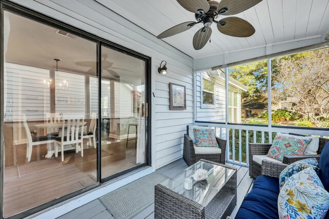 sunroom / solarium with ceiling fan