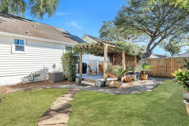 back of house featuring a pergola, a lawn, and central air condition unit