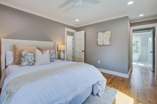 bedroom featuring recessed lighting, crown molding, baseboards, and wood finished floors