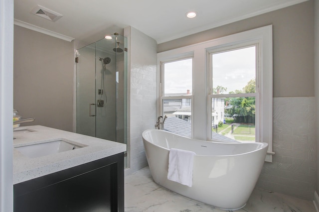 full bathroom featuring a freestanding tub, visible vents, marble finish floor, a shower stall, and double vanity