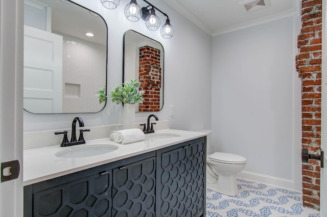 bathroom featuring toilet, crown molding, visible vents, and a sink