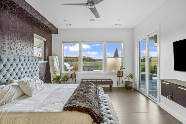 bedroom with ceiling fan and access to exterior