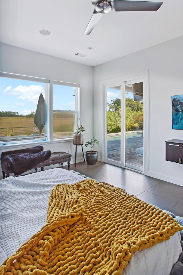 bedroom with ceiling fan and access to outside