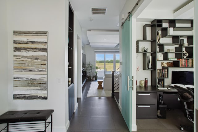 hallway featuring a barn door