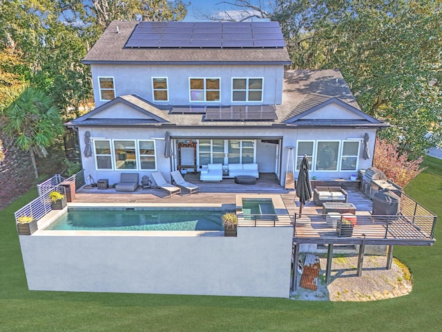 rear view of house featuring a patio, solar panels, and outdoor lounge area