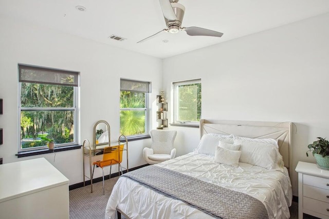 carpeted bedroom with ceiling fan