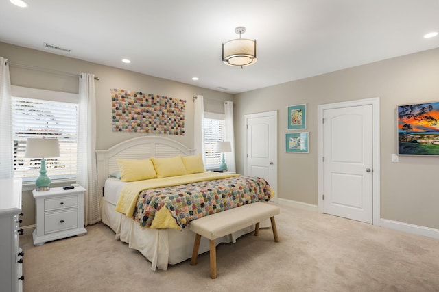 bedroom with light colored carpet