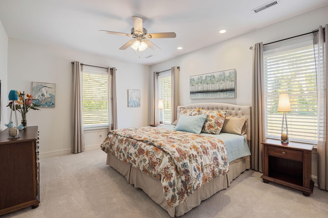 bedroom featuring ceiling fan and light colored carpet