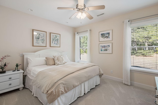 carpeted bedroom featuring ceiling fan