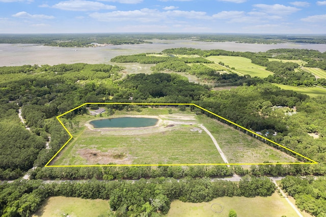 drone / aerial view featuring a rural view and a water view