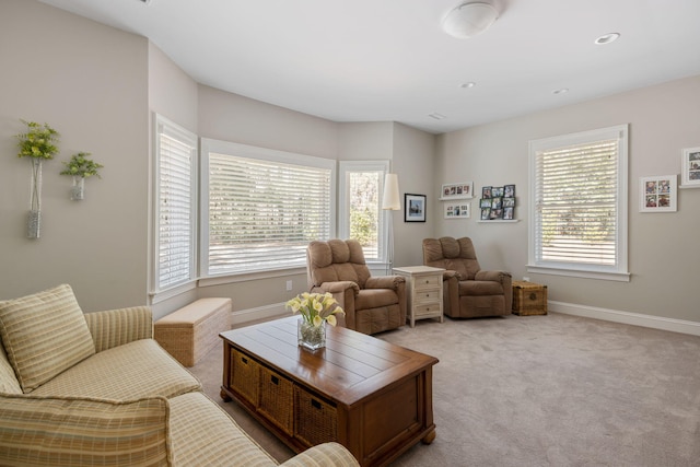 living room with light colored carpet and a wealth of natural light