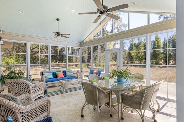 sunroom featuring ceiling fan and vaulted ceiling