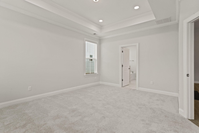 unfurnished room with recessed lighting, ornamental molding, visible vents, a raised ceiling, and carpet floors