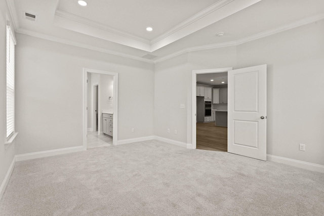unfurnished bedroom with crown molding, light colored carpet, visible vents, and recessed lighting