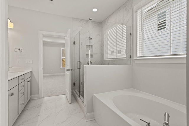 full bathroom with baseboards, marble finish floor, a garden tub, vanity, and a marble finish shower