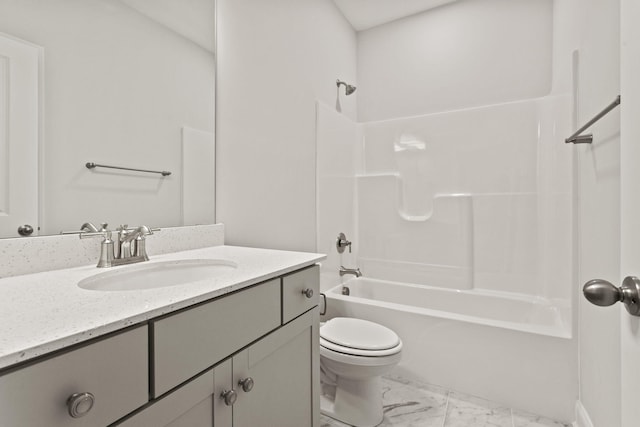 bathroom with vanity, toilet, bathtub / shower combination, and marble finish floor