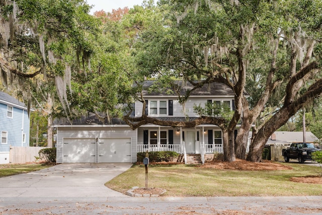 view of front of home with a porch and a front lawn