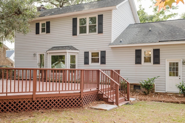 rear view of property with a wooden deck