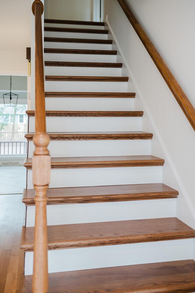 stairway featuring hardwood / wood-style floors