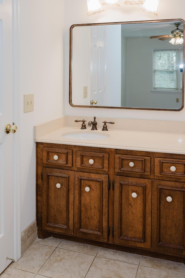 bathroom featuring ceiling fan, tile patterned flooring, and vanity