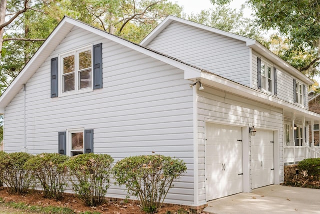 view of property exterior with a garage