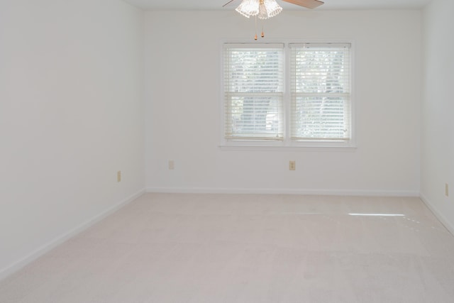 spare room with ceiling fan