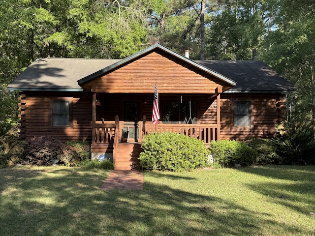 1020 Welles Ln, Walterboro, SC 29488 - view of front facade featuring a porch, a front lawn, and log exterior