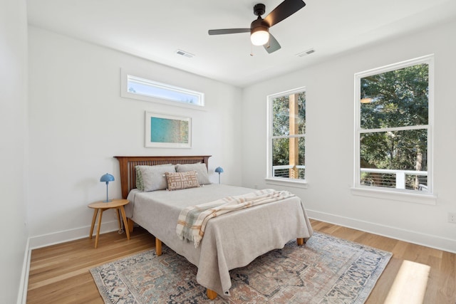 bedroom featuring ceiling fan and light hardwood / wood-style flooring