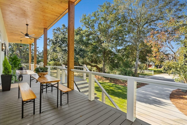 wooden deck featuring ceiling fan