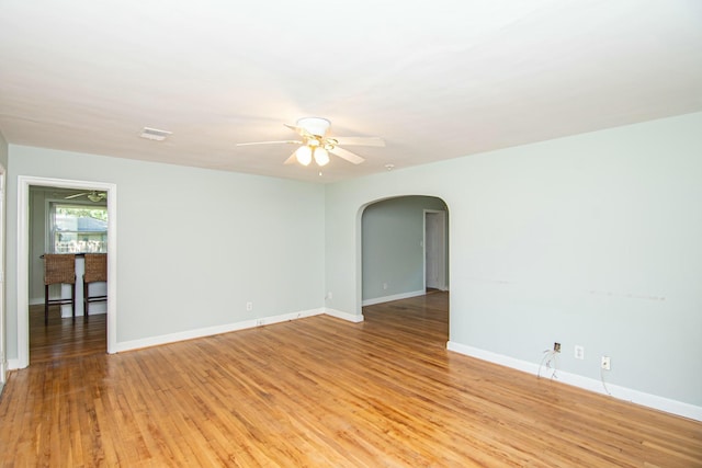 unfurnished room with ceiling fan and light hardwood / wood-style flooring