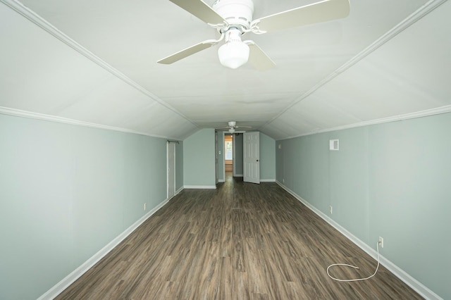 additional living space featuring ceiling fan, dark hardwood / wood-style flooring, and vaulted ceiling