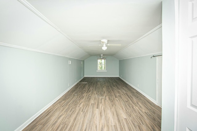 additional living space featuring ceiling fan, wood-type flooring, and lofted ceiling