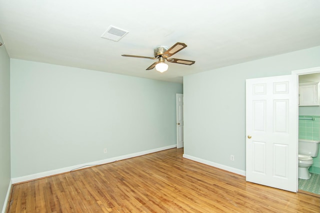 unfurnished room with ceiling fan and light hardwood / wood-style floors