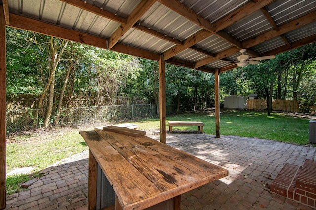 view of patio with a shed and ceiling fan