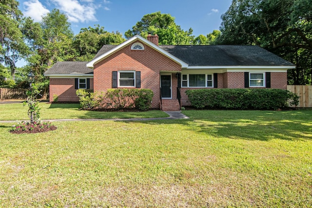 ranch-style home featuring a front yard