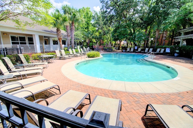 view of swimming pool featuring a patio