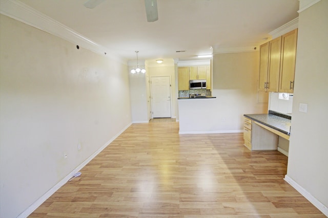 kitchen with light brown cabinets, light wood-type flooring, and ornamental molding