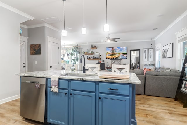 kitchen featuring ceiling fan, stainless steel dishwasher, blue cabinets, a center island with sink, and ornamental molding