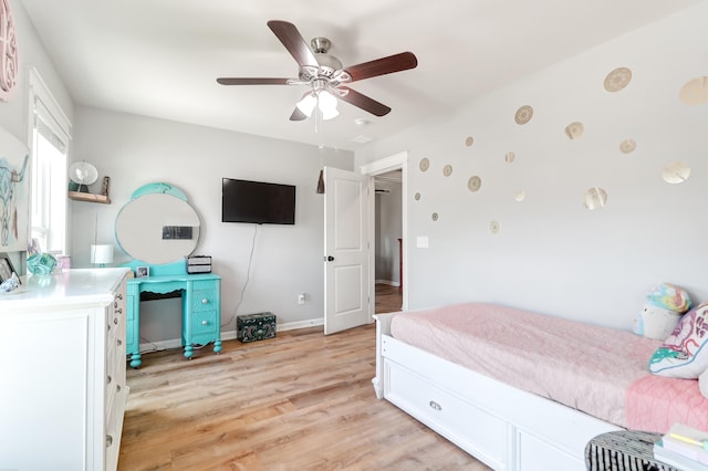 bedroom with light hardwood / wood-style flooring and ceiling fan