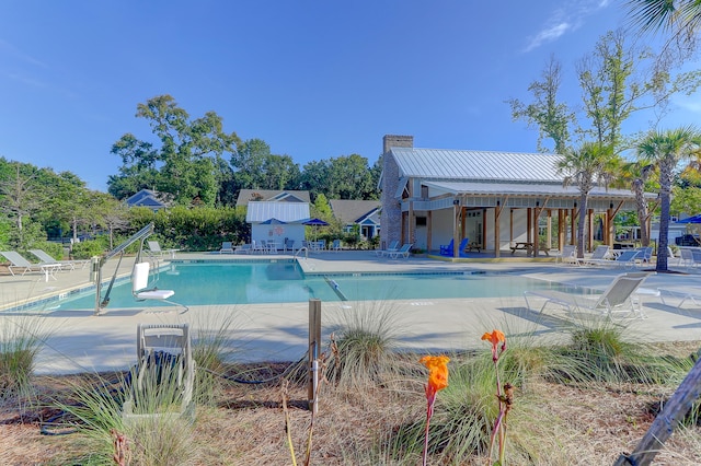 view of swimming pool featuring a patio