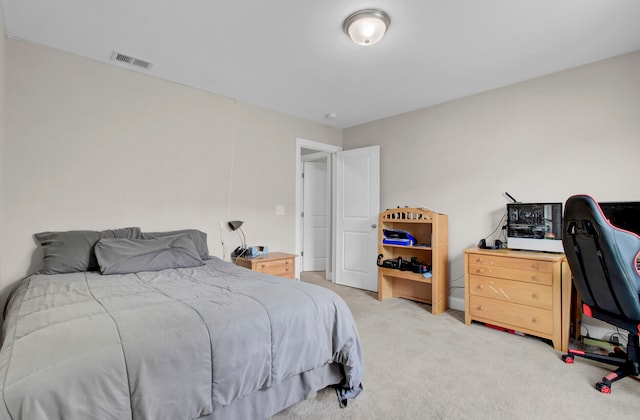 bedroom featuring light colored carpet