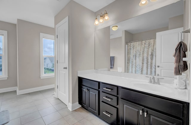 bathroom with large vanity and tile floors