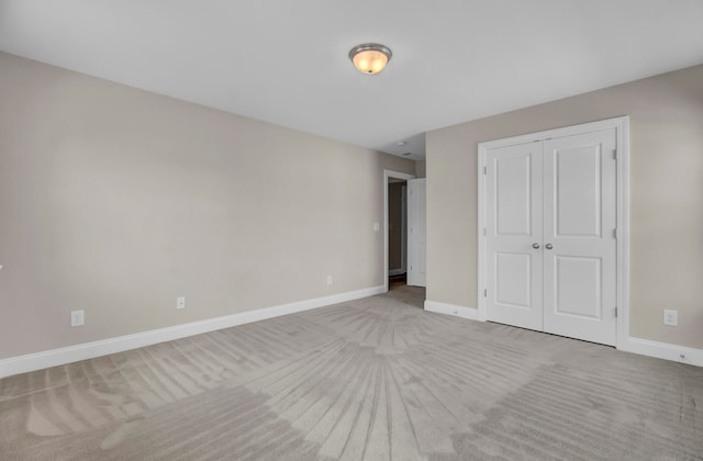 unfurnished bedroom featuring a closet and carpet